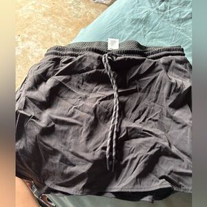 They are black. It’s a skirt with shorts made under it.